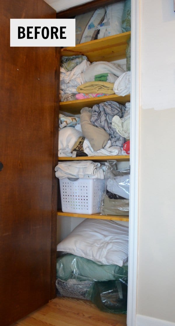 hall closet organization ideas and hall closet storage ideas - messy linen closet before