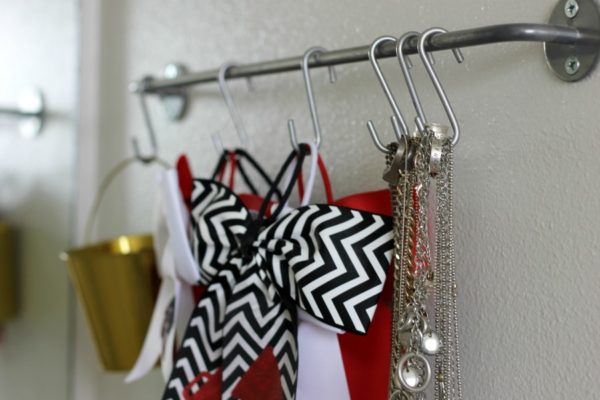 Make space around your vanity by using S hooks to hold buckets filled with jewelry, hair accessories and more.