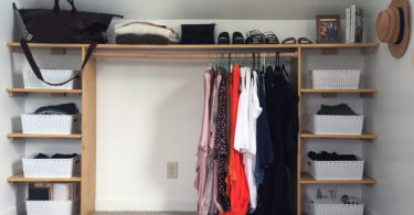 DIY Dressing Room: closet with shelves organizing clothes, bins, and shoes