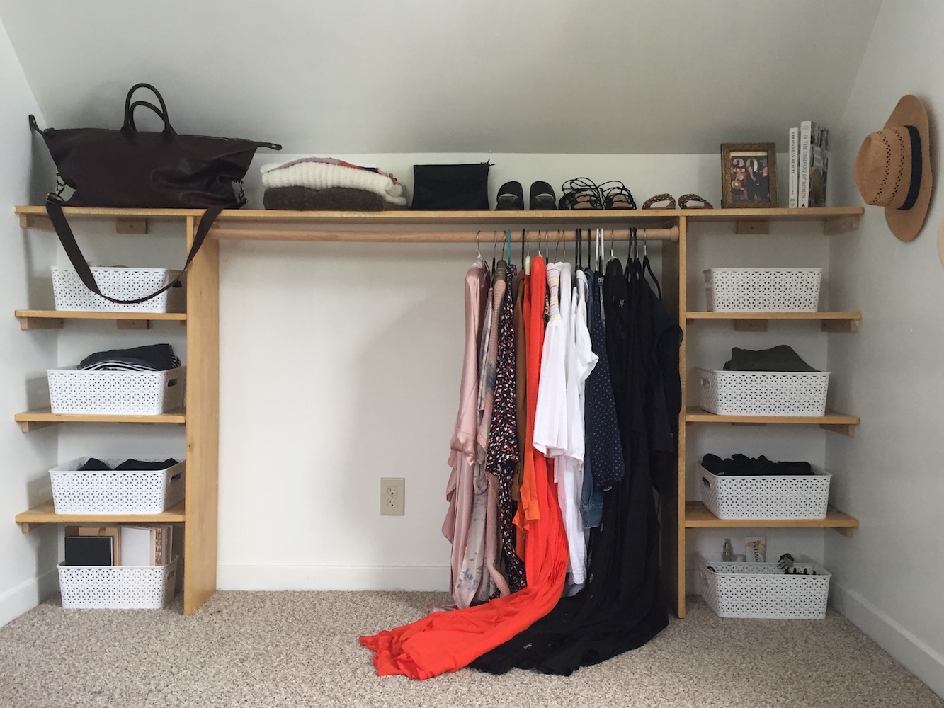 DIY Dressing Room: Photo of entire closet with shelving, clothes, bins, purses, shoes, and hat