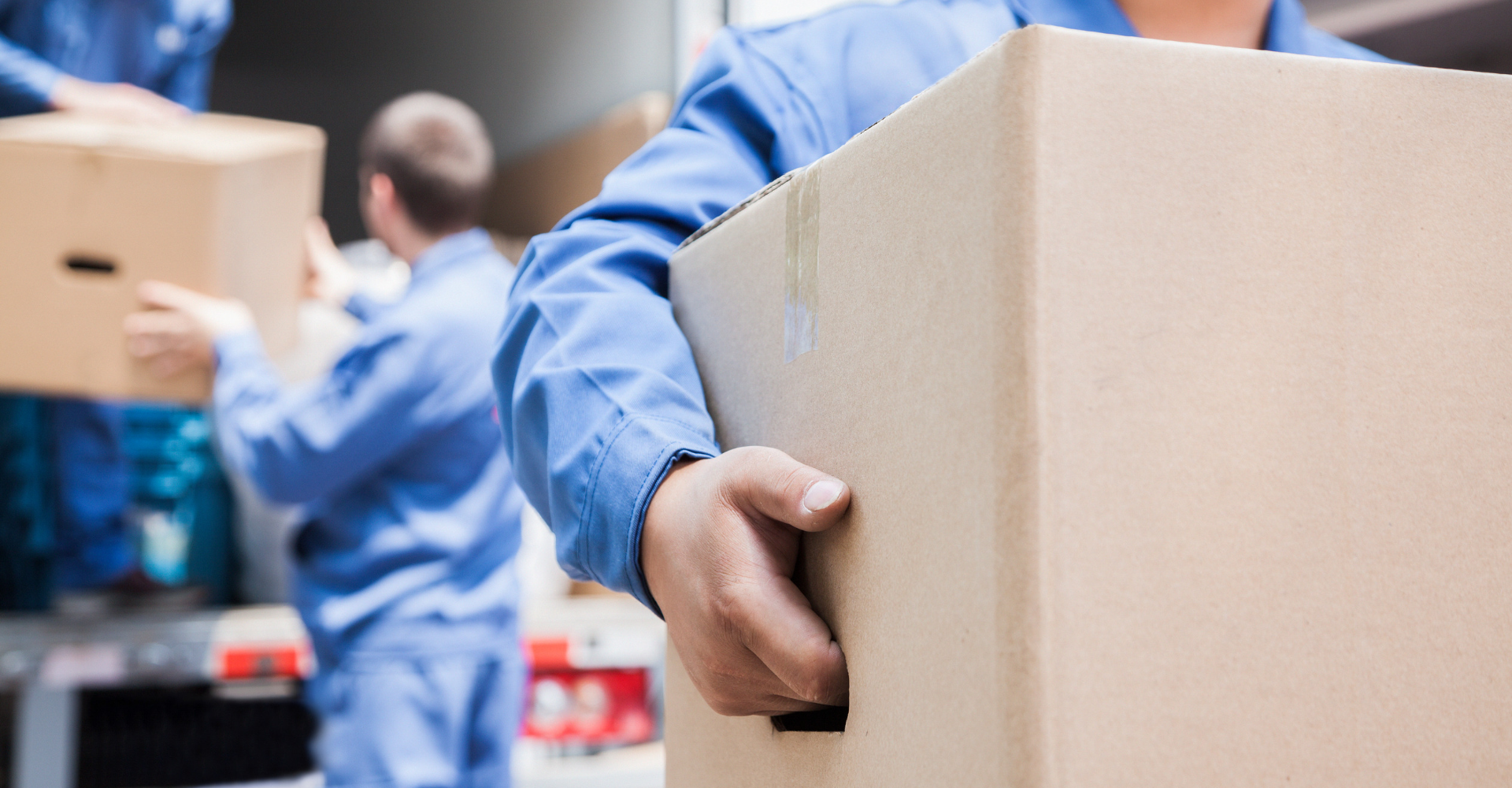 Packing and Unpacking - Best Packing Tips for Moving Day - Movers carrying boxes