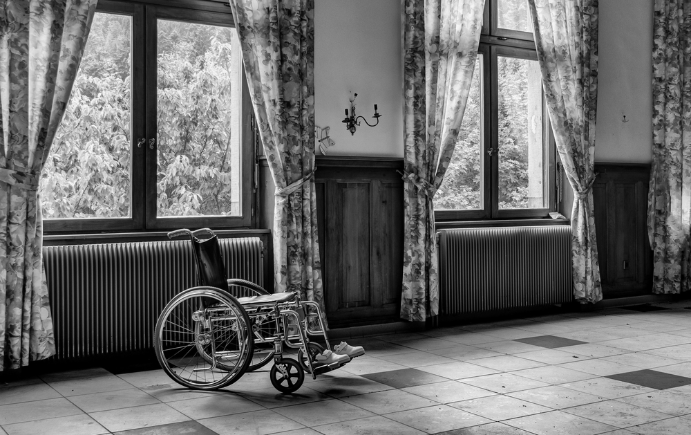 Black and white room with wheelchair - Moving with a Disability