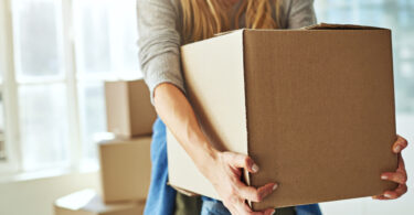 Woman moving box