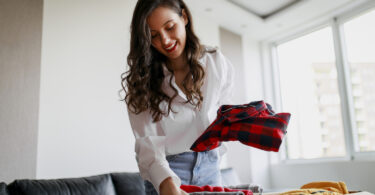 Woman putting clothes in seasonal storage