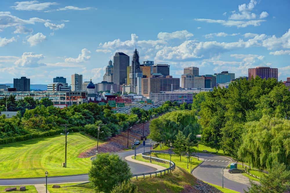 Daytime shot of Hartford, CT skyline. Featured Image for Pros & Cons of Living in Hartford